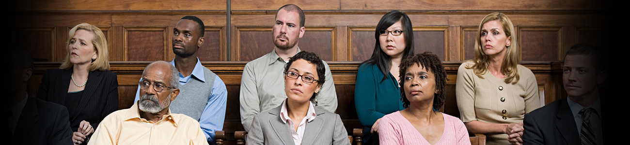 Group of people sitting in a courtroom gallery